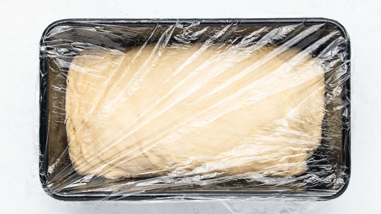 Covered dough in loaf pans