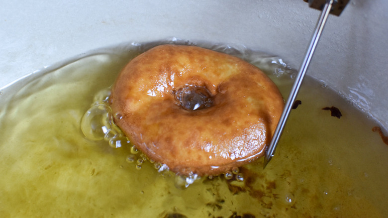 doughnut frying in oil