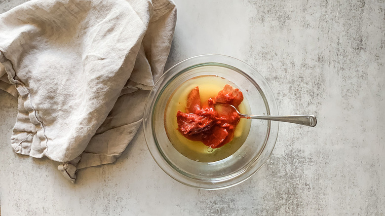 tomato paste, sugar, and vinegar in bowl