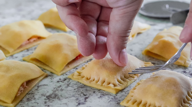 fork pressing edges of ravioli