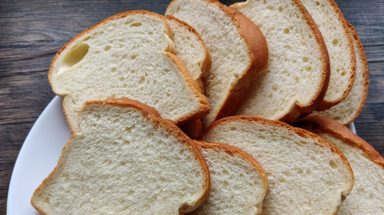 Sliced white bread on plate