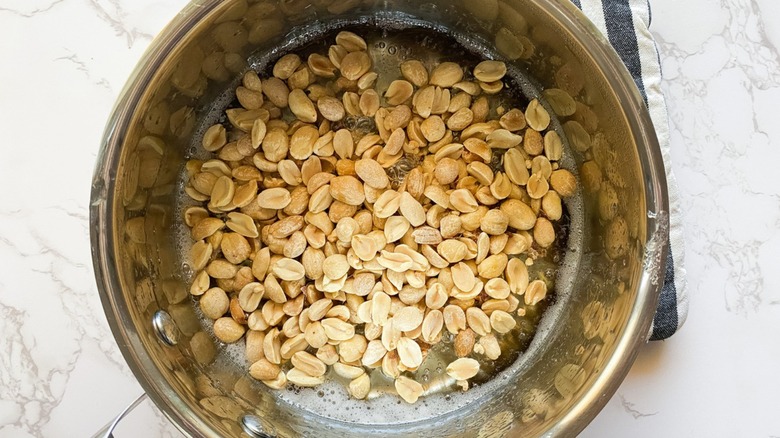 peanuts stirred into syrup