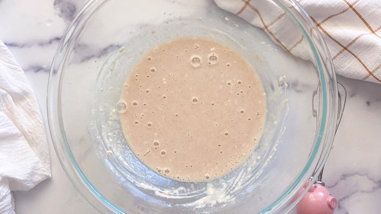 Bubbly yeast mixture in a glass bowl