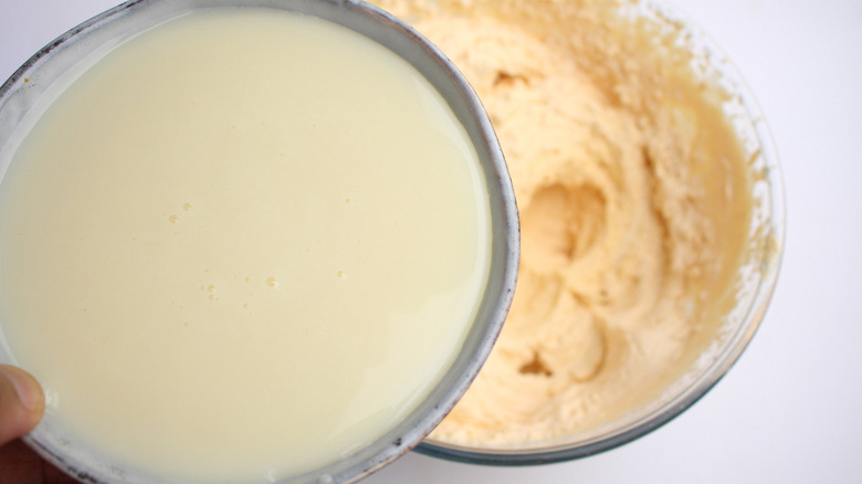 pouring the sweetened condensed milk 