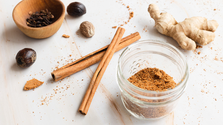 spice mix in jar with whole spices