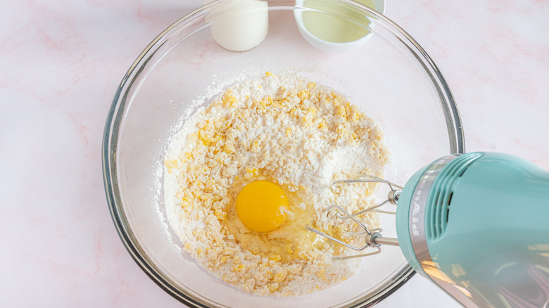 mixing wet ingredients for cupcakes