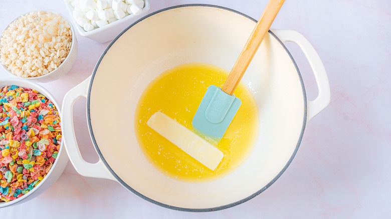 melting butter for homemade rice crispy treats with Fruity Pebbles