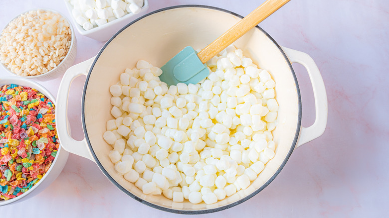 melting marshmallows for homemade rice crispy treats with Fruity Pebbles