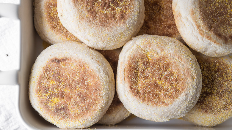 Homemade Sourdough English Muffins in a platter