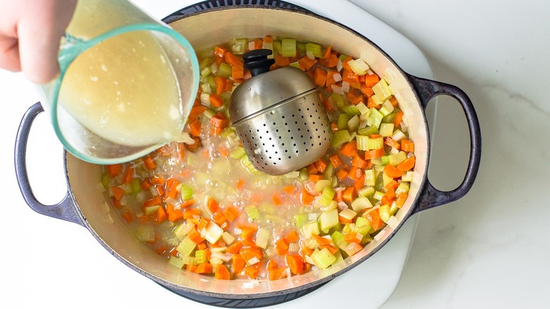 Adding turkey broth to vegetables