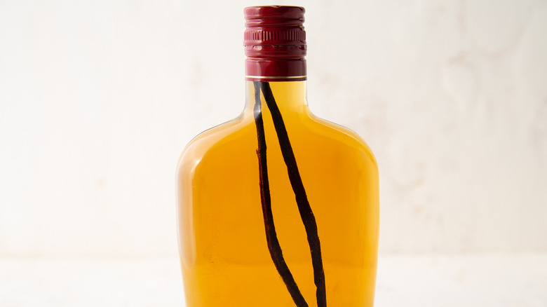 vanilla beans in brandy bottle