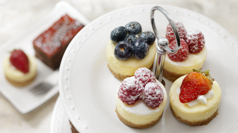plate of four mini cheesecakes