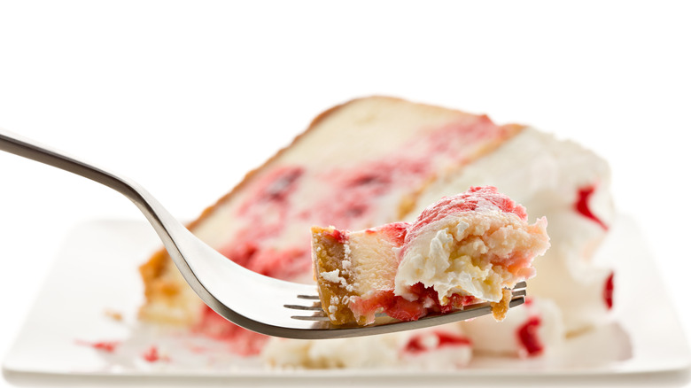 strawberry cheesecake on fork