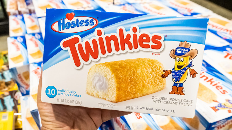 Someone holds a box of Twinkies