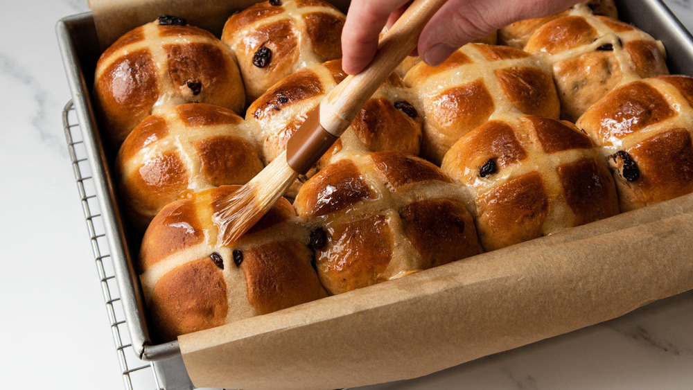 Glazing the hot cross buns