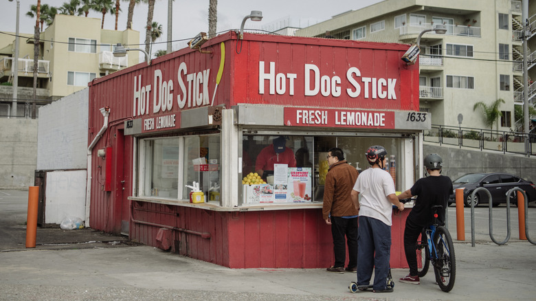 customers at Hot Dog on a Stick stand