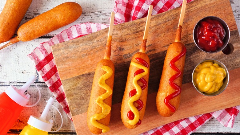 corn dogs with mustard and ketchup