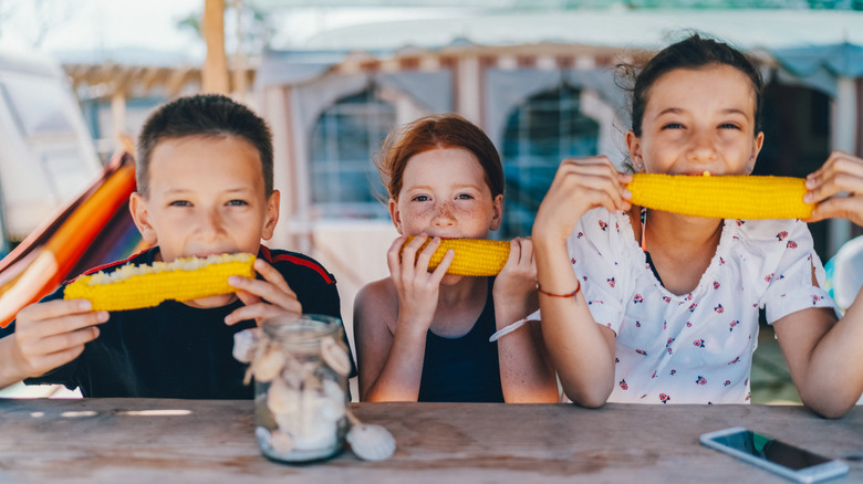 kids eating corn on the cob