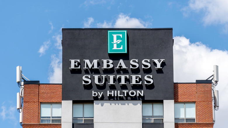 embassy suites sign with sky in the background