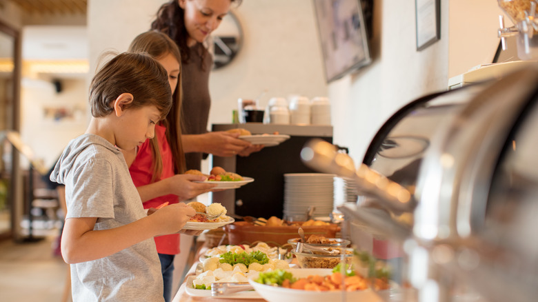 Mom and kids enjoying the breakfast buffet