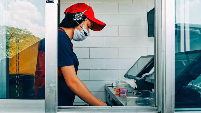 Drive-thru worker wearing mask