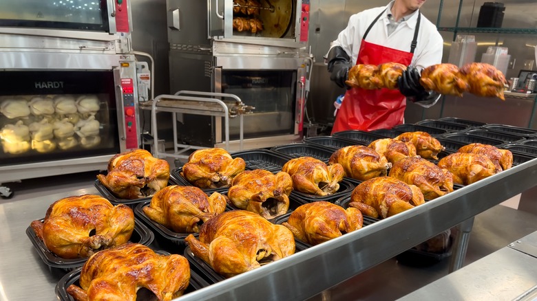 Costco rotisserie chickens being prepared