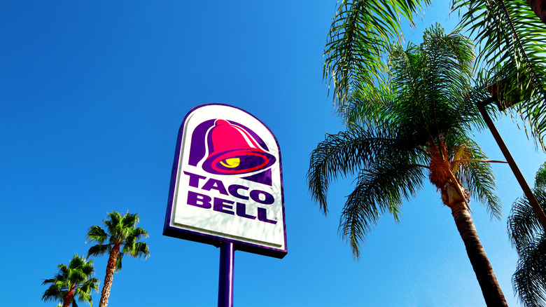 taco bell sign with palm trees