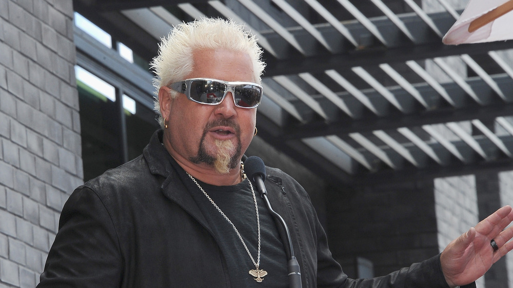 Guy Fieri in silver sunglasses