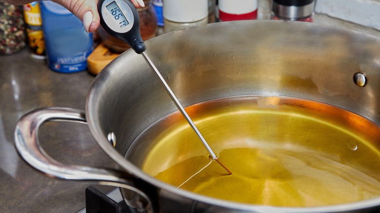 Food thermometer checking cooking oil