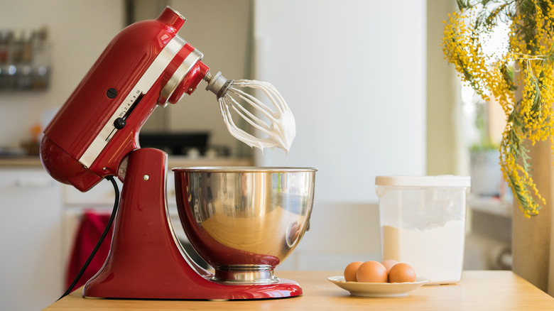 Red stand mixer and eggs