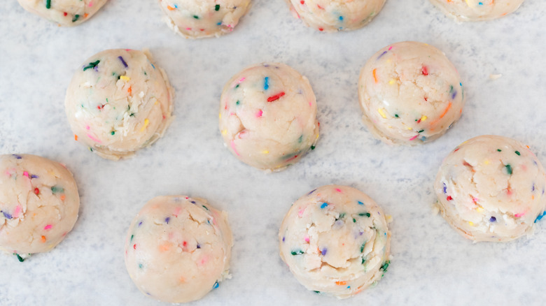 Cookie dough with sprinkles on a counter top