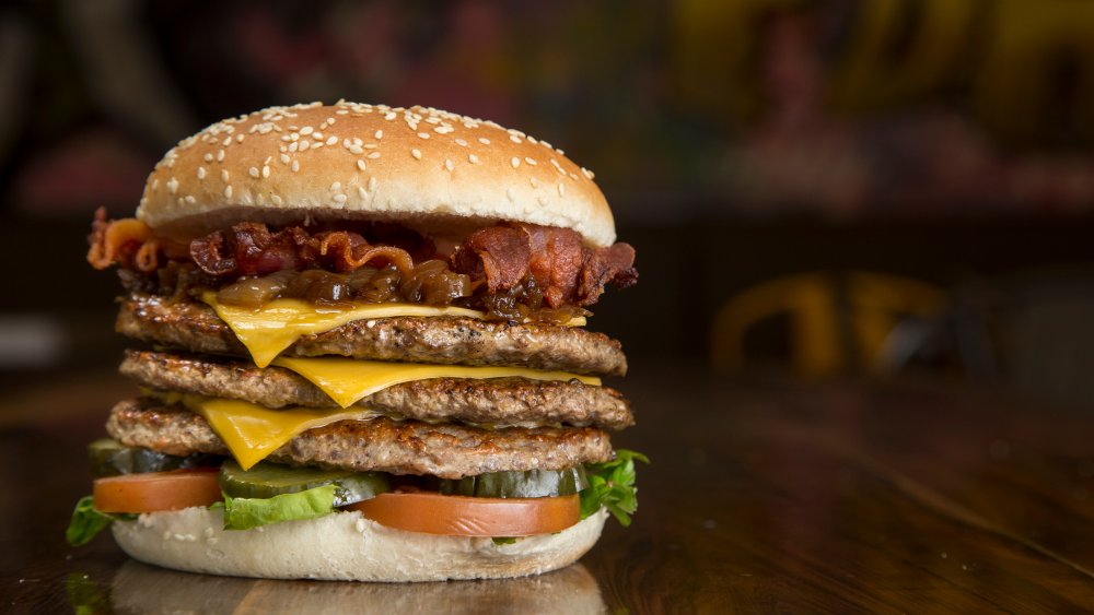 triple hamburger with bacon, lettuce, and tomato