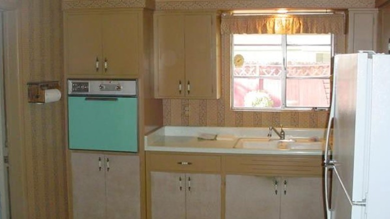 1960s kitchen with wooden cabinets