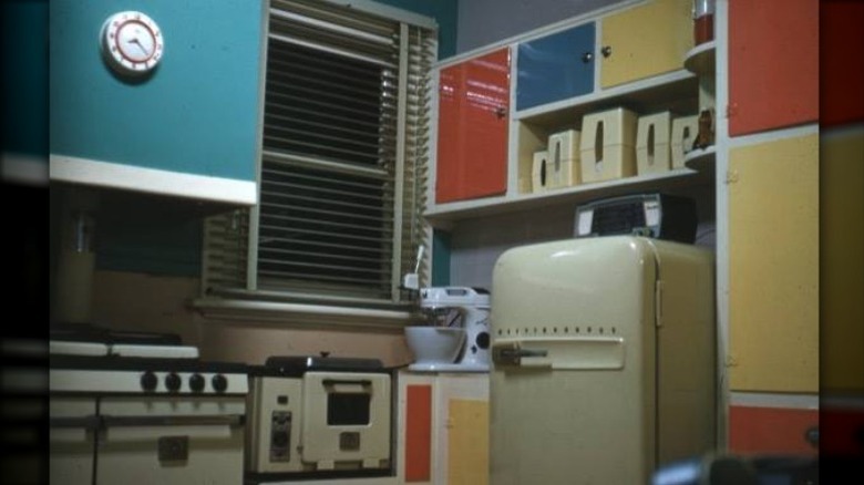 1960s kitchen with large refrigerator 