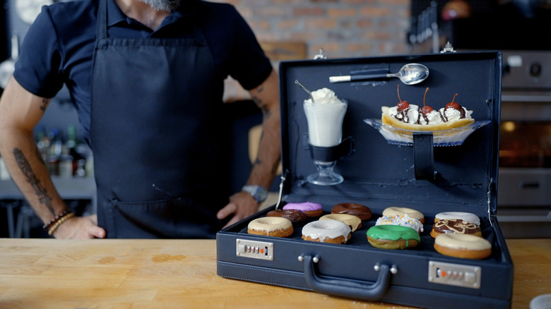 Andrew Rea beside Patrick's Suitcase