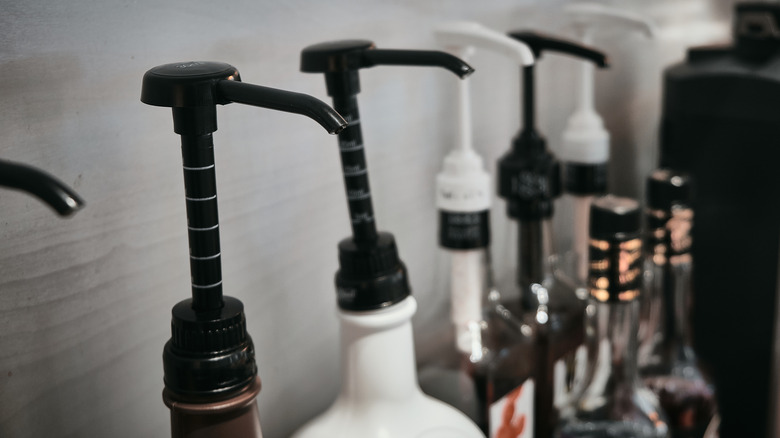 row of coffee syrup pumps