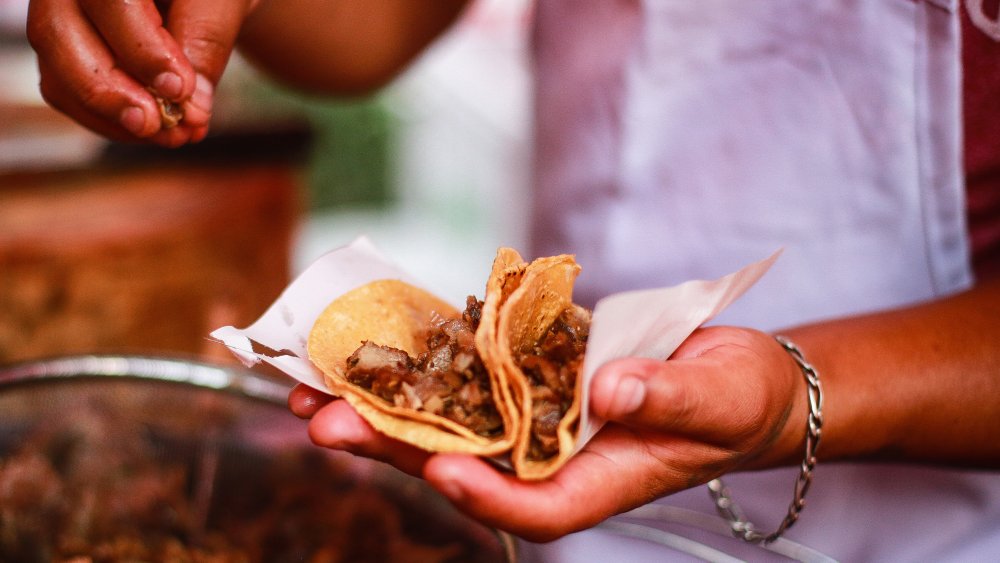 non-authentic taco with shredded cheese