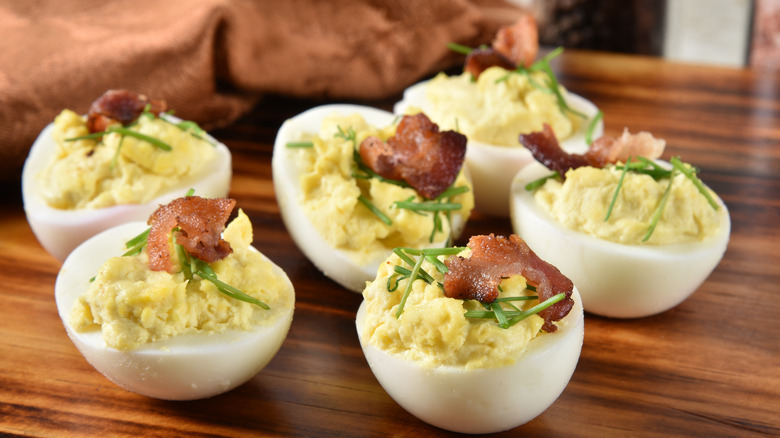 Deviled eggs with bacon bits and chives