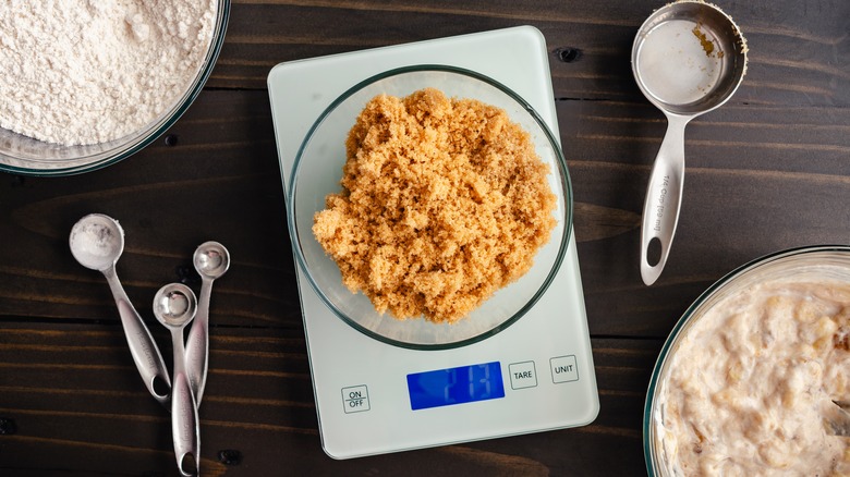 sugar being weighed using kitchen scale