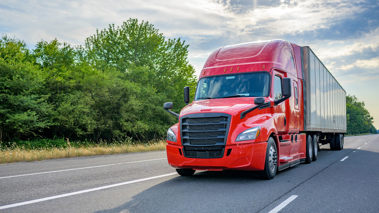 tractor trailer truck with red cab