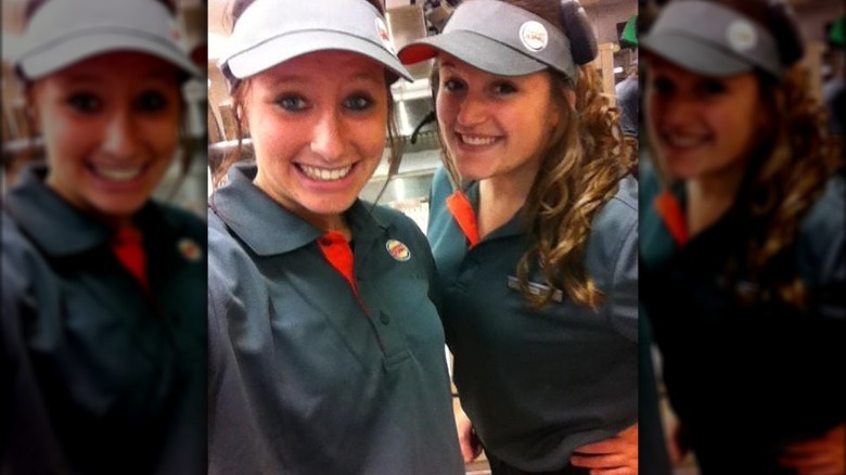 Smiling Burger King girls with visors