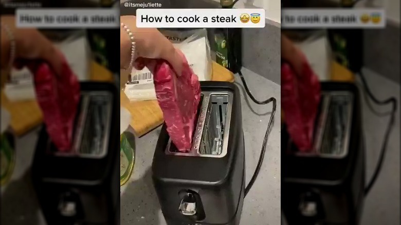 person putting raw steak into toaster