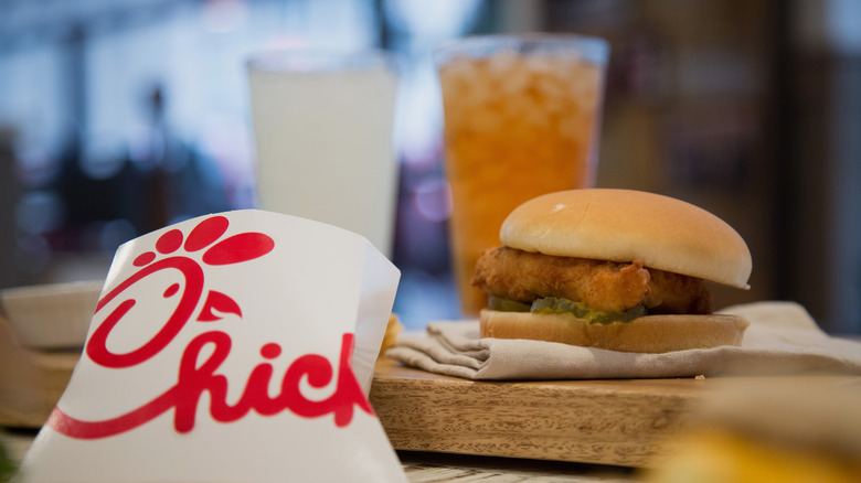 Chicken sandwich next to Chick-fil-A packaging