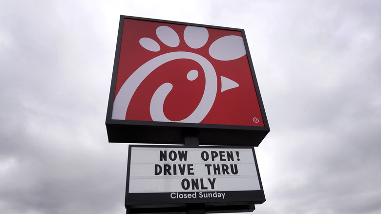 The Chick-fil-A sign against a gray sky