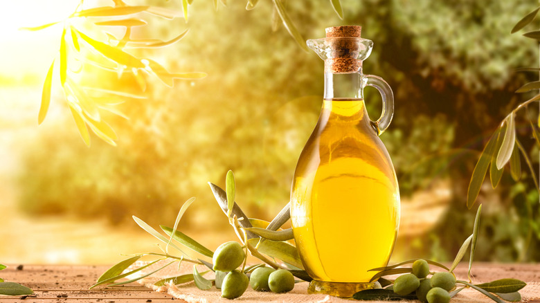 olive oil and olives outdoors