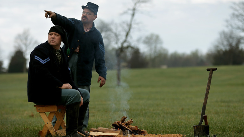 Union soldier reenactors making coffee