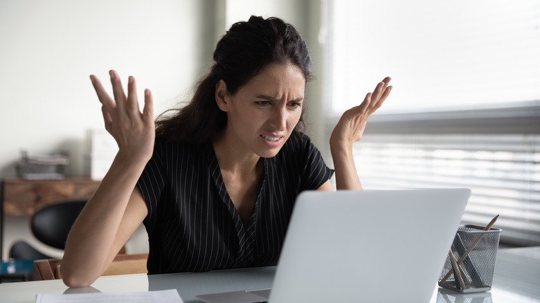 woman frustrated with something online