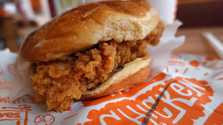 An unwrapped Popeye's chicken sandwich