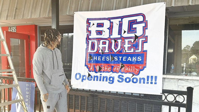 Derrick Hayes in front of future store