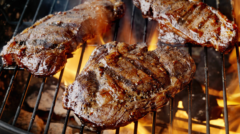 steaks on a grill